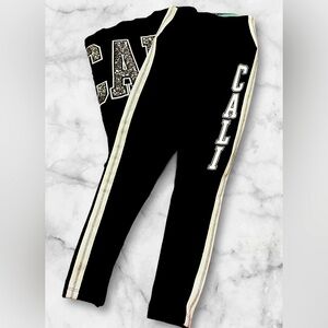 Rare PINK VS “Cali” leggings. Black with white/silver trim. Size XSmall.